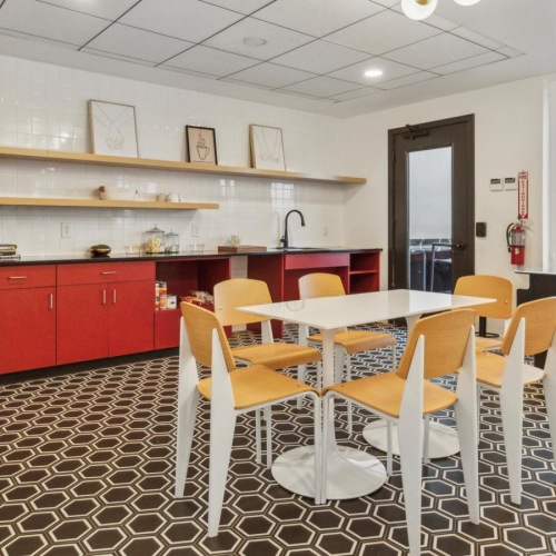 a kitchen with a table and chairs