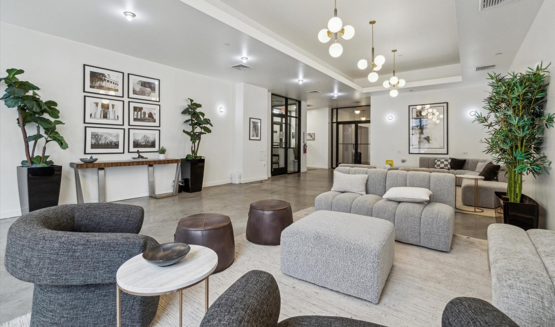 a room with a couch and chairs