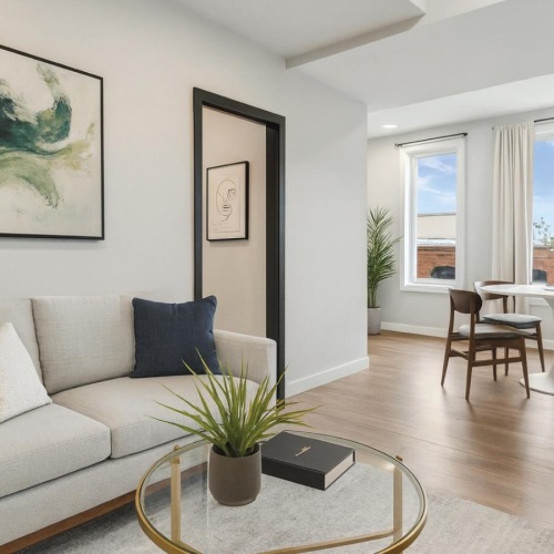 a living room with a couch and a table